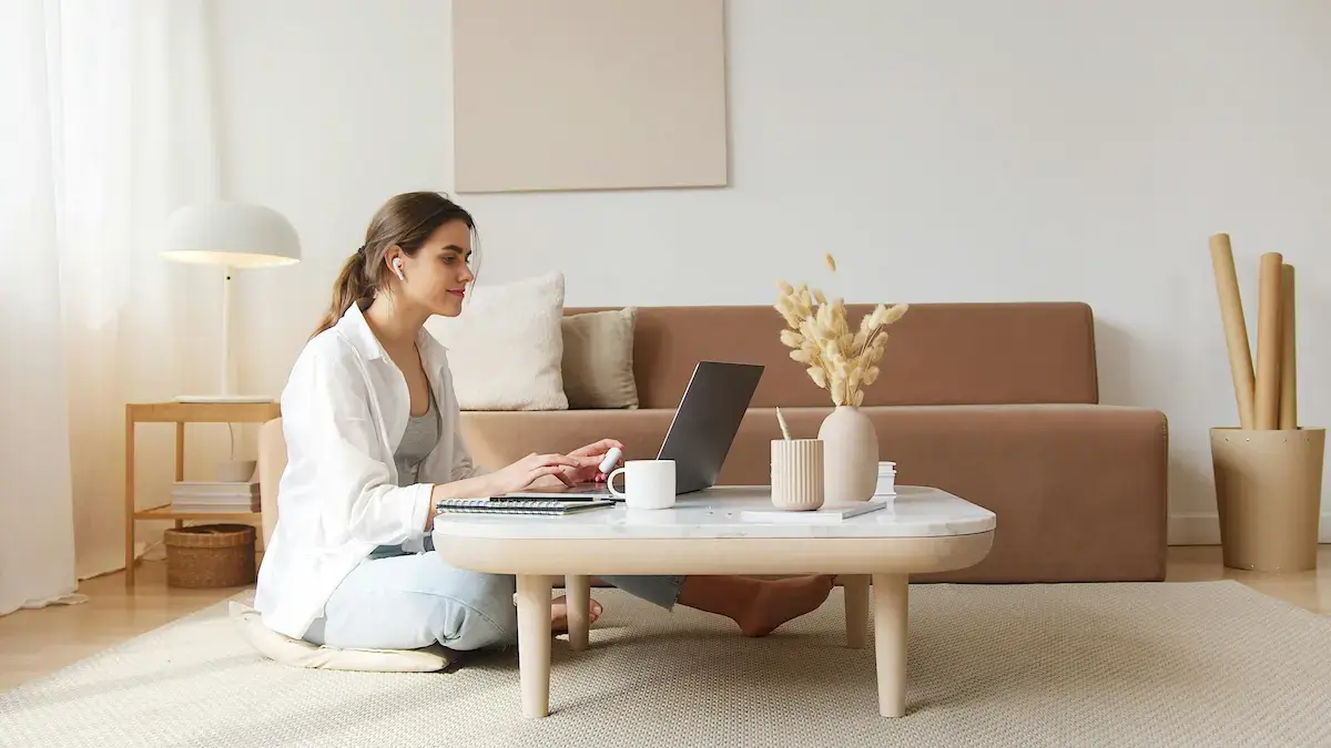 A student studying online at home while using a laptop during an online tutoring session